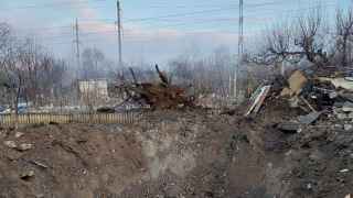 Воронка после российского ракетного обстрела в Запорожье